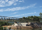 Puente de acero prefabricado de Bailey para el puente portátil del acero estructural del proyecto de la conservación del agua con los embarcaderos favorables proveedor